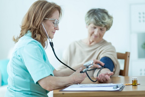elderly woman having a blood pressure